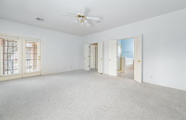 unfurnished bedroom with visible vents, light carpet, ensuite bathroom, access to outside, and ceiling fan