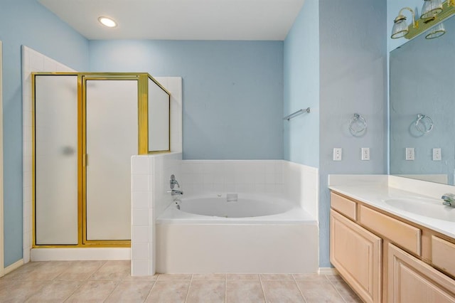 full bathroom with tile patterned floors, a shower stall, vanity, and a garden tub