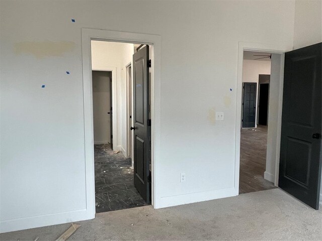 unfurnished bedroom featuring baseboards
