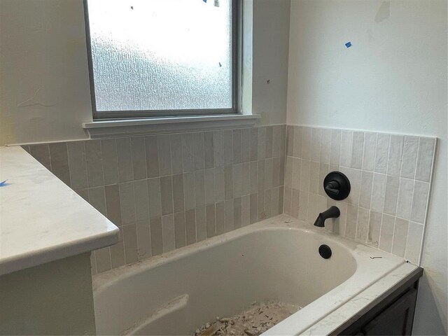 full bath featuring a bath