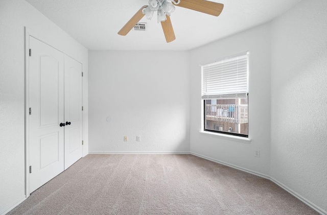 3833 Ives Way, Norman, OK 73072 - unfurnished bedroom featuring carpet flooring, a ceiling fan, and baseboards