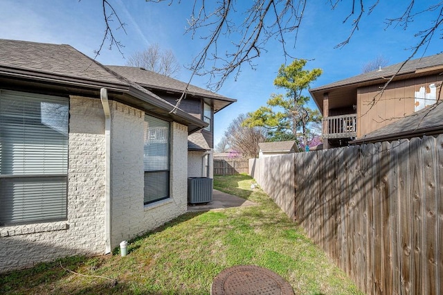 3833 Ives Way, Norman, OK 73072 - view of home's exterior featuring central AC unit and a shingled roof