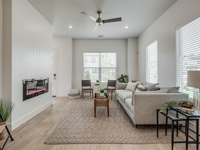 13112 Maplewood Ave, Oklahoma City, OK 73120 - living room featuring wood finished floors, ceiling fan, baseboards, and recessed lighting