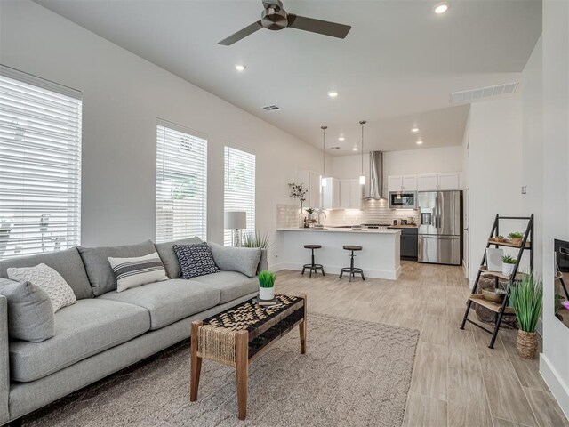 13112 Maplewood Ave, Oklahoma City, OK 73120 - living room featuring recessed lighting, ceiling fan, baseboards, and light wood-style floors