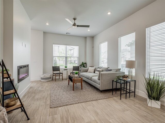 13112 Maplewood Ave, Oklahoma City, OK 73120 - living room with baseboards, a ceiling fan, wood finished floors, recessed lighting, and heating unit