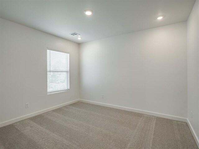 13112 Maplewood Ave, Oklahoma City, OK 73120 - empty room featuring baseboards, light carpet, and recessed lighting