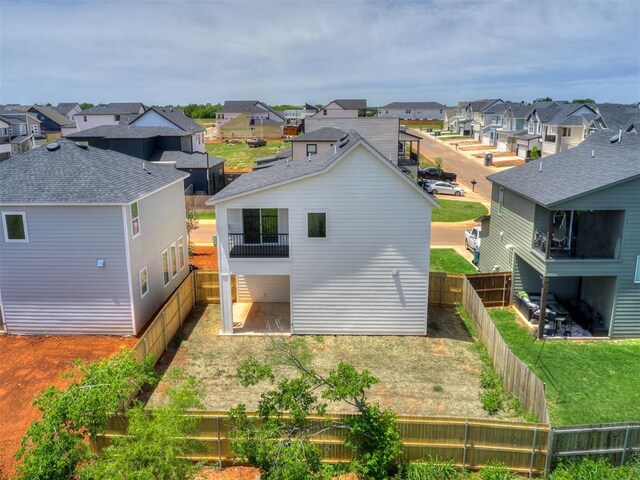 13112 Maplewood Ave, Oklahoma City, OK 73120 - back of property with a residential view, a balcony, and a fenced backyard