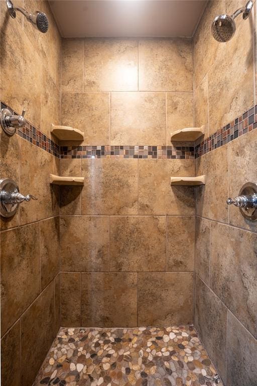 bathroom with tiled shower