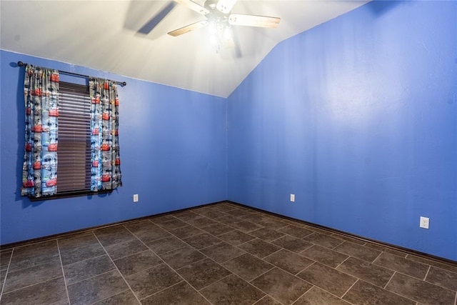 spare room featuring lofted ceiling and ceiling fan