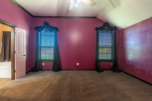 interior space featuring ceiling fan, lofted ceiling, carpet, and baseboards