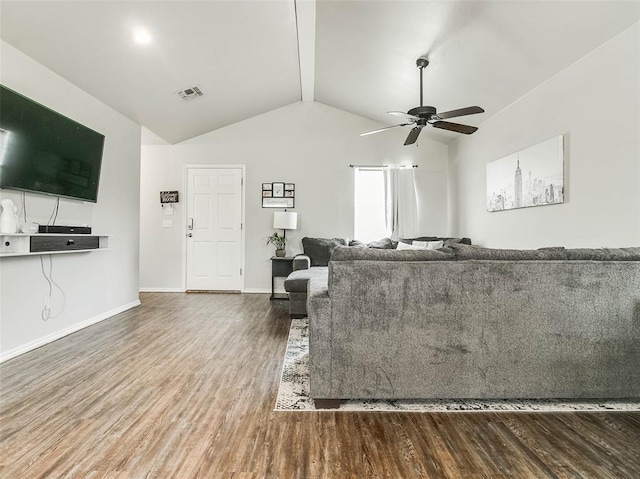 1419 NW 98th St, Oklahoma City, OK 73114 - unfurnished living room featuring visible vents, vaulted ceiling with beams, baseboards, ceiling fan, and wood finished floors