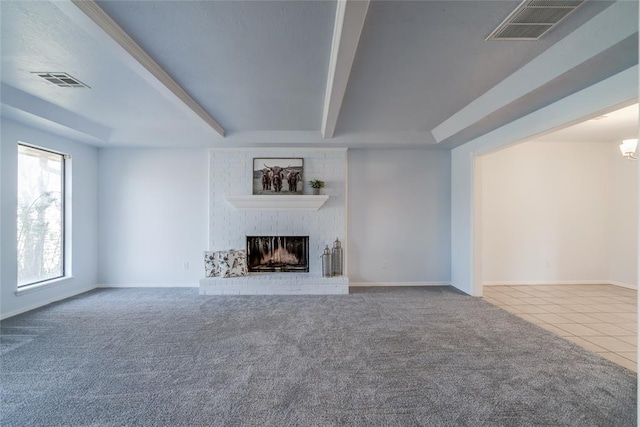 2408 Cypress Ct, Edmond, OK 73013 - unfurnished living room featuring a brick fireplace, carpet, tile patterned floors, and baseboards