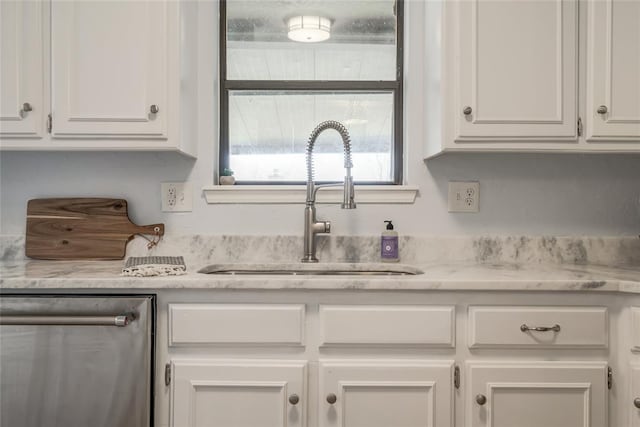 2408 Cypress Ct, Edmond, OK 73013 - kitchen with stainless steel dishwasher, a sink, and white cabinets