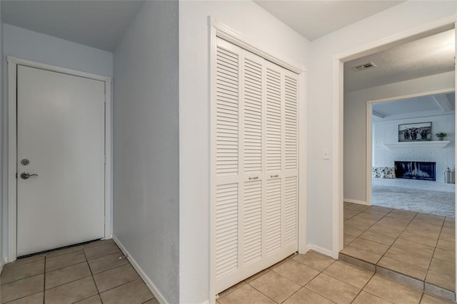 2408 Cypress Ct, Edmond, OK 73013 - hallway featuring light tile patterned floors and baseboards