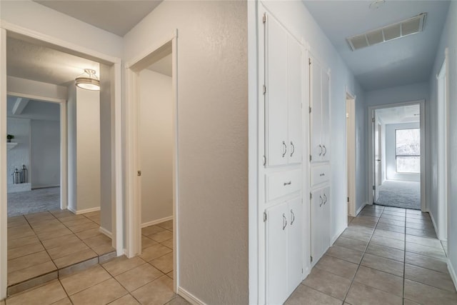 2408 Cypress Ct, Edmond, OK 73013 - corridor with light tile patterned flooring and baseboards