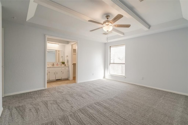 2408 Cypress Ct, Edmond, OK 73013 - unfurnished bedroom featuring light carpet, ensuite bathroom, baseboards, a sink, and ceiling fan