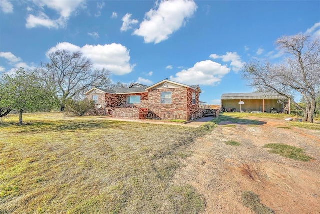 17421 E 1160th Rd, Sweetwater, OK 73666 - view of front of house featuring brick siding and a front yard