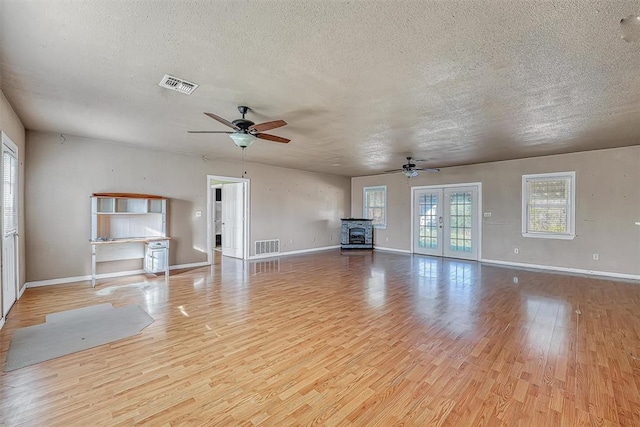 17421 E 1160th Rd, Sweetwater, OK 73666 - unfurnished living room with visible vents, light wood-style floors, and ceiling fan