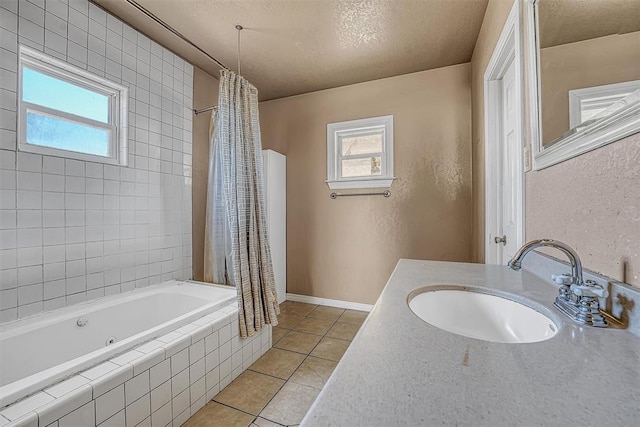 17421 E 1160th Rd, Sweetwater, OK 73666 - bathroom featuring tiled shower / bath, a textured ceiling, tile patterned flooring, baseboards, and a textured wall