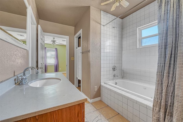17421 E 1160th Rd, Sweetwater, OK 73666 - bathroom with tiled shower / bath, a wealth of natural light, a ceiling fan, and tile patterned flooring