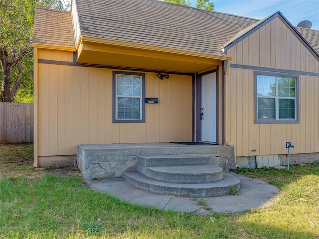 3604 NW 27th St, Oklahoma City, OK 73107 - property entrance featuring roof with shingles and fence