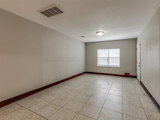3604 NW 27th St, Oklahoma City, OK 73107 - unfurnished room with light tile patterned flooring, visible vents, and baseboards