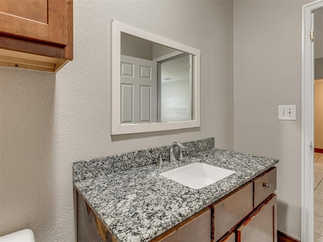 3604 NW 27th St, Oklahoma City, OK 73107 - bathroom featuring vanity and a textured wall