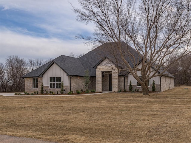 2292 NW 34th St, Newcastle, OK 73065 - view of front of property featuring a front lawn, roof with shingles, stone siding, and board and batten siding