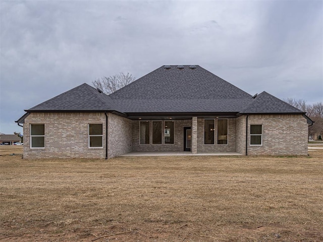 2292 NW 34th St, Newcastle, OK 73065 - back of property featuring roof with shingles, brick siding, and a patio