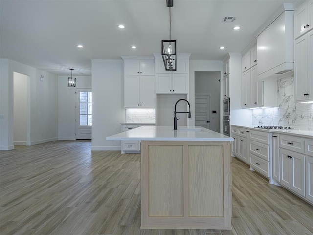 2292 NW 34th St, Newcastle, OK 73065 - kitchen featuring a sink, tasteful backsplash, appliances with stainless steel finishes, baseboards, and light countertops