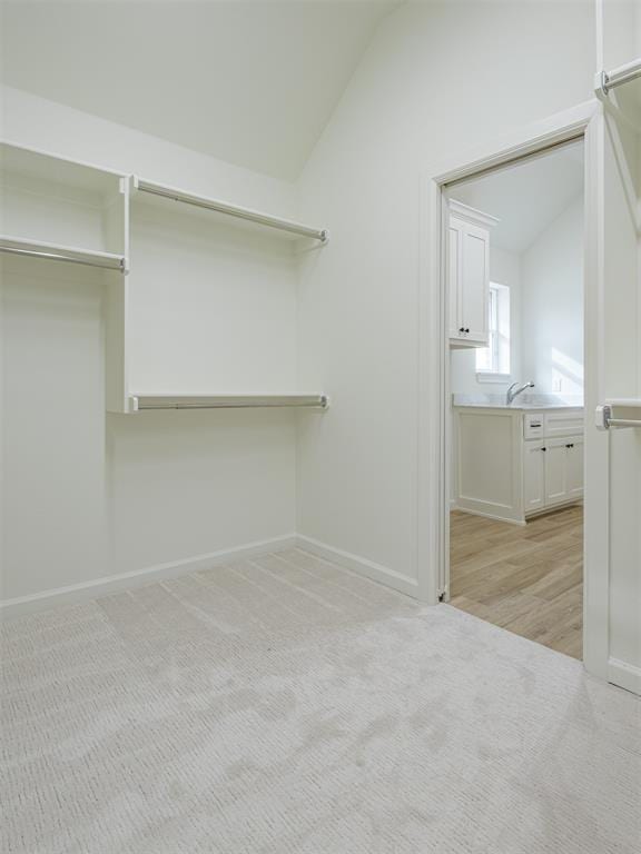 2292 NW 34th St, Newcastle, OK 73065 - spacious closet with lofted ceiling and light carpet