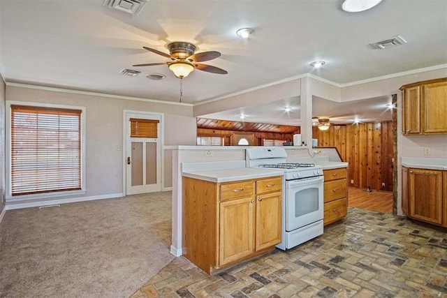 kitchen featuring white range with gas cooktop, ornamental molding, visible vents, and ceiling fan