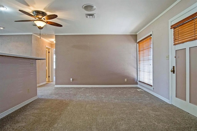 unfurnished living room with visible vents, crown molding, a ceiling fan, and carpet floors