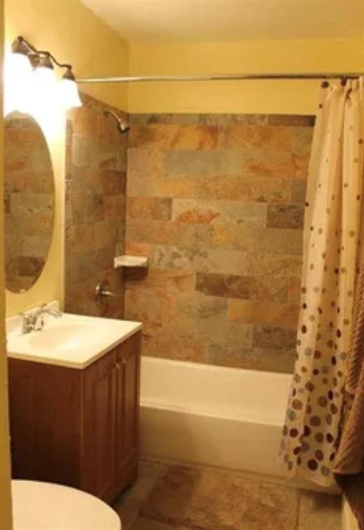 2941 SW 48th St, Oklahoma City, OK 73119 - full bathroom with tile patterned floors, toilet, shower / bath combo with shower curtain, and vanity