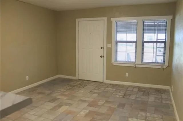 2941 SW 48th St, Oklahoma City, OK 73119 - spare room featuring baseboards