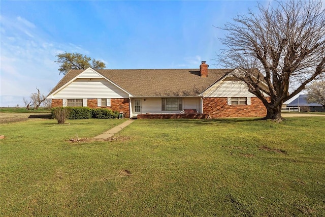 13225 E 740th Rd, Kingfisher, OK 73750 - view of front of property with brick siding, a chimney, and a front yard