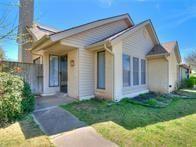 7320 NW 101st St, Oklahoma City, OK 73162 - view of front of house with a chimney and a front yard