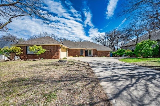 2008 Powderhorn, Edmond, OK 73034 - single story home with a front yard, brick siding, a garage, and driveway