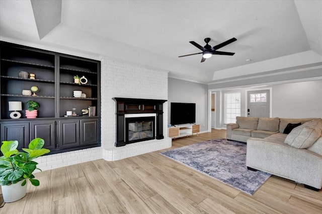 2008 Powderhorn, Edmond, OK 73034 - living area with a raised ceiling, wood finished floors, and ceiling fan