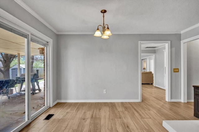 2008 Powderhorn, Edmond, OK 73034 - spare room with a notable chandelier, visible vents, light wood-type flooring, and ornamental molding