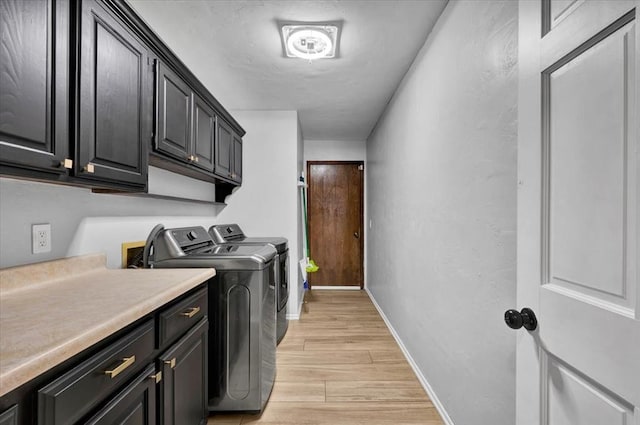 2008 Powderhorn, Edmond, OK 73034 - washroom featuring cabinet space, light wood-type flooring, baseboards, and separate washer and dryer