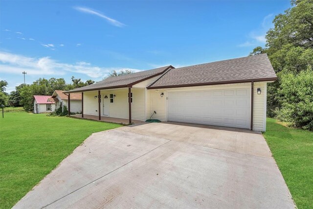 311 N 7th St, Sayre, OK 73662 - single story home with a porch, a front lawn, concrete driveway, an attached garage, and a shingled roof