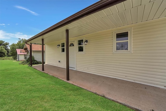 311 N 7th St, Sayre, OK 73662 - property entrance featuring a yard and a patio