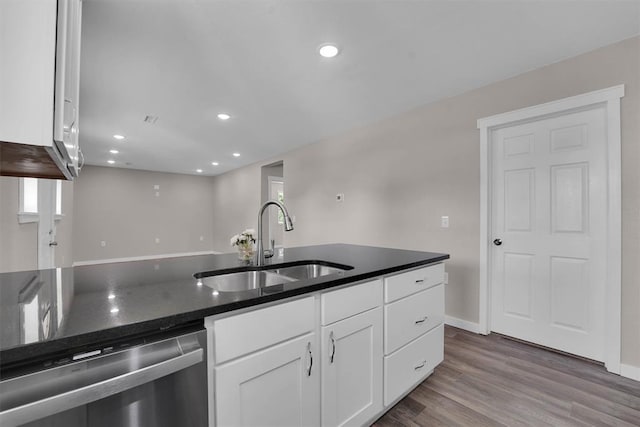 311 N 7th St, Sayre, OK 73662 - kitchen featuring dishwasher, white cabinets, dark stone countertops, dark wood-type flooring, and recessed lighting