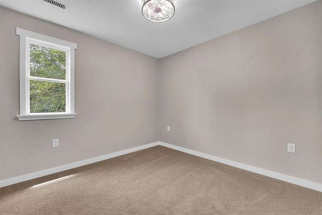311 N 7th St, Sayre, OK 73662 - carpeted empty room with baseboards