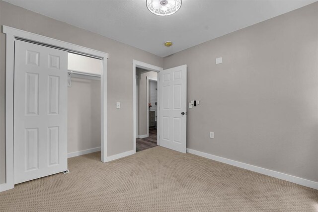 311 N 7th St, Sayre, OK 73662 - unfurnished bedroom featuring light colored carpet and a closet