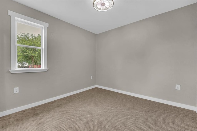 311 N 7th St, Sayre, OK 73662 - carpeted empty room with baseboards