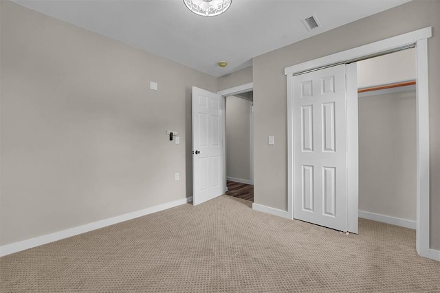 311 N 7th St, Sayre, OK 73662 - unfurnished bedroom with light colored carpet and a closet
