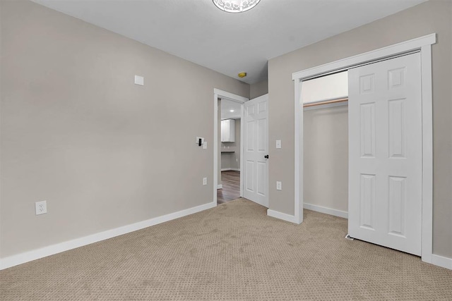 311 N 7th St, Sayre, OK 73662 - unfurnished bedroom featuring light carpet and a closet