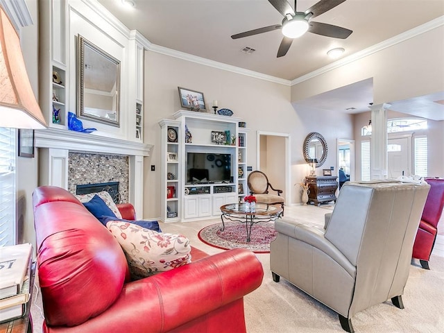 living room featuring visible vents, a ceiling fan, a fireplace, decorative columns, and light colored carpet